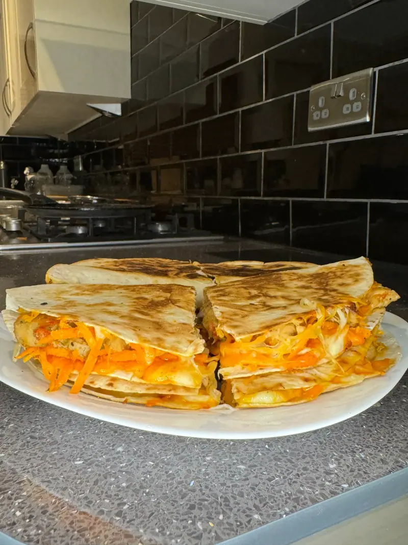 A platter of toasted wrap halves, ready for a team lunch